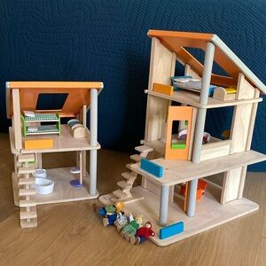 Plan Toys wooden chalet style doll house with furniture